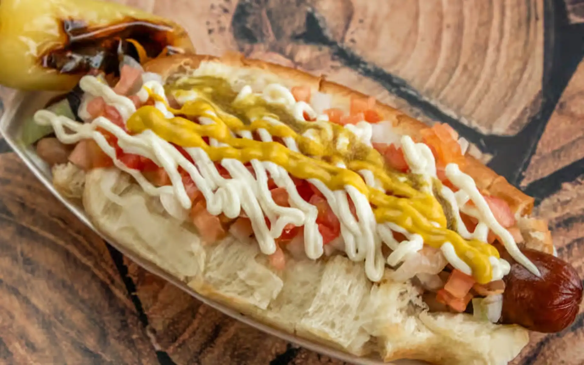 El Guero Canelo signature dishes Sonoran Style Hot DogCarne Asada TacosCaramelos